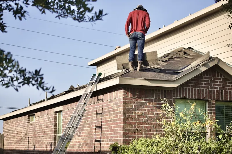 Professional roofer working on a residential roof in Lavonia